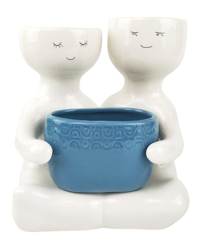 Friends Holding a Blue Pot Planter